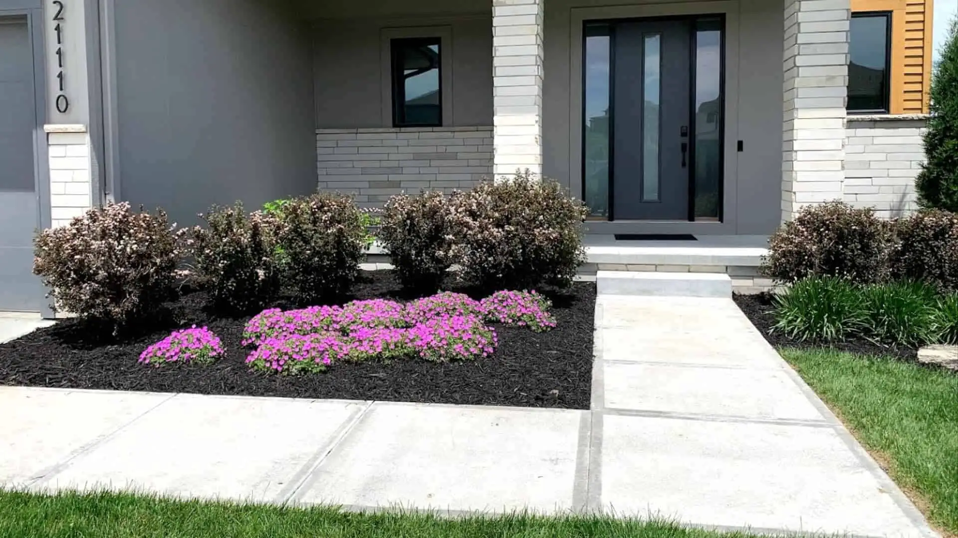 Mulch And Plants To Decorate Front Of Home